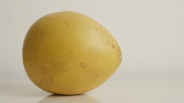 Tilting over Citrus maxima grandis close-up 4K 2160p 30fps UltraHD  footage - Slow tilt on yellow po alt