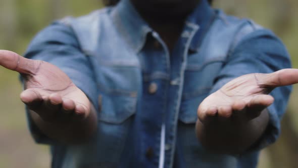 Close Up. African Man Putting the Open Palms Together alt