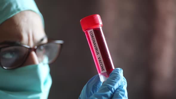 Doctor holding a recipient with the coronavirus COVID-19 vaccine