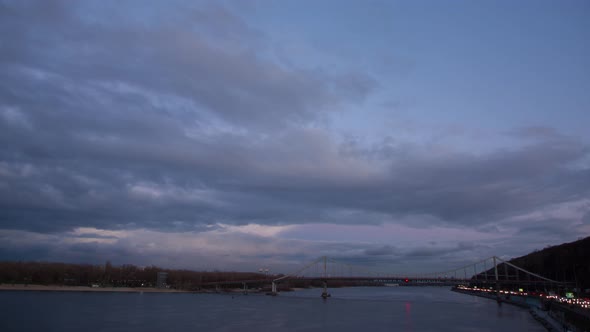 Big Bridge Across The River At Sunset In Kiev, Fast Clouds