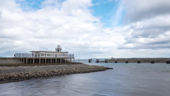 Timelapse of an abandoned lighthouse by the water alt