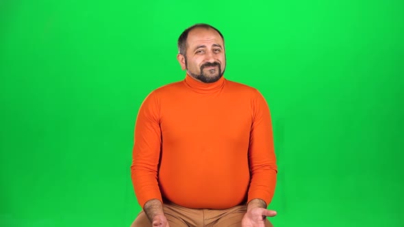 Caucasian Man Thinks Then Shrugs Disappointedly, No Idea. Green Screen. Slow Motion alt