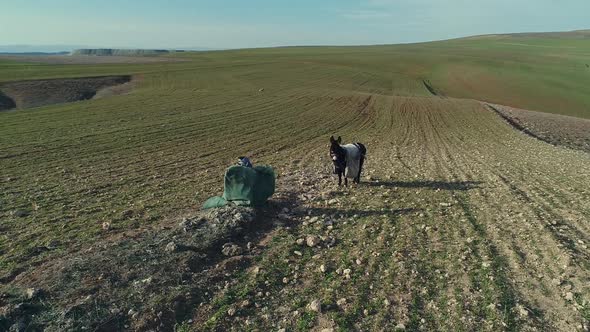 A shepherd resting with his donkey alt