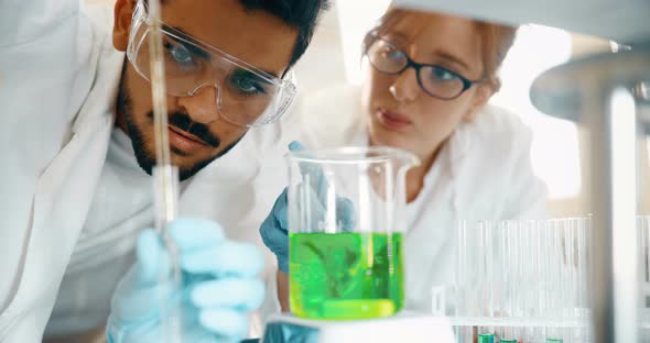 Young Students of Chemistry Working in Laboratory