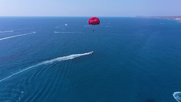 Parasailing Over the Mediterranean Sea on a Hot Day in Cyprus