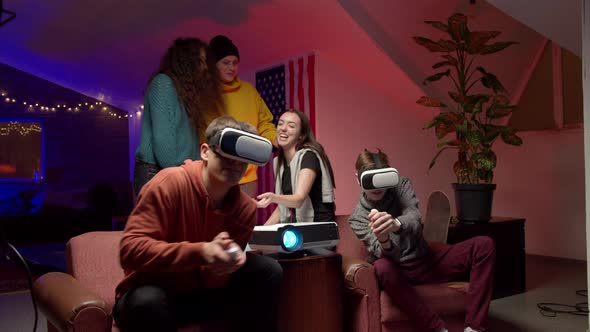 Group of Young Friends Playing Virtual Videogame