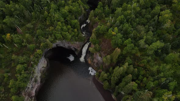 beautiful waterfall by lake superior on the north shore minnesota during late summer aerial view alt