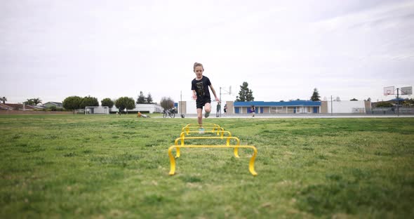 Girl Practices Running Drills