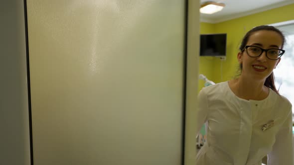 Doctor Opening Door and Welcoming Patient to Office for Consultation alt