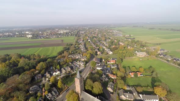 Drone flying over church and rural town alt
