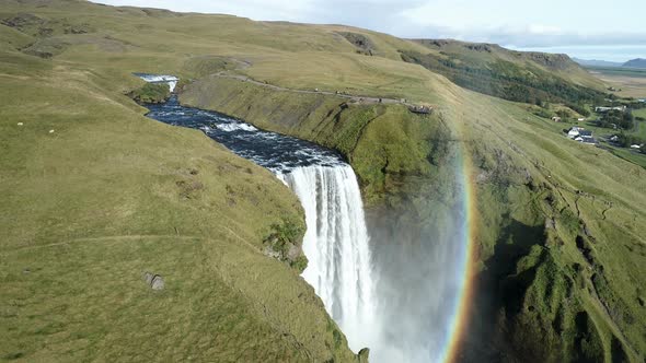 Waterfall And Rainbow In Cinematic Landscape