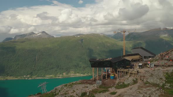 Tourists At Eggen Restaurant Overlooking Green Mountains And Fjord In ...