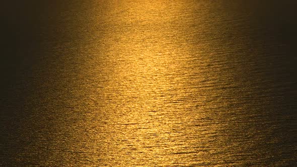 Surface of Endless Rippling Sea in Golden Light of Sunset Glow, Beautiful Nature alt