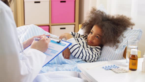 Doctor with Clipboard and Sick Girl in Bed at Home alt