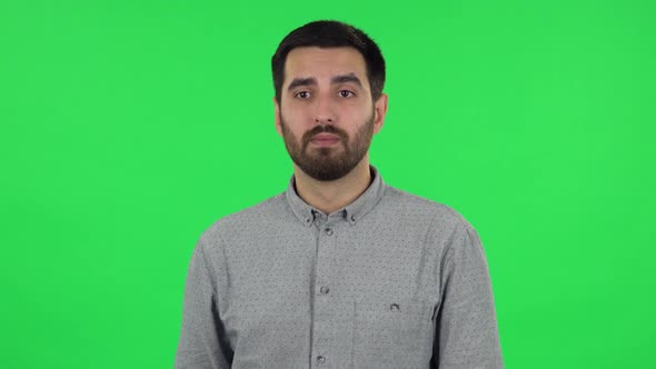 Portrait of Brunette Guy Is Waiting, Then Celebrating His Victory Triumph. Green Screen alt