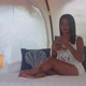 Pretty Woman Sitting on the Bed Inside Tent House and Using Her Mobile Phone - VideoHive Item for Sale
