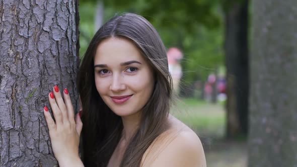 Smiling Lady Near Tree Flirting Open Look, Beautiful Smile of Woman Outdoors