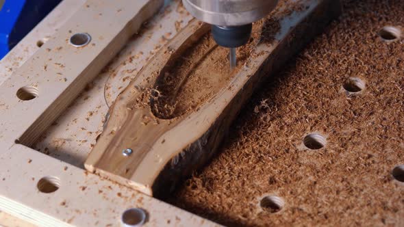 Automatic Milling Cutting Wood Machine. Drill Holes for the Pieces of Wood. Closeup. alt