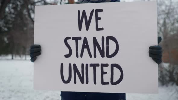 We Stand united is written. Challenge For People To Stay All Together and fight alt