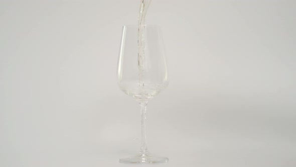 Close Up Shot of Pouring Red Wine in Glass at 1000 Fps White Background alt