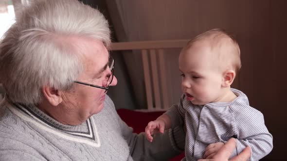 Family Relations of Elderly Man and Baby Girl alt