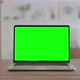 Open Laptop with Green Screen on Desk Chrome Key