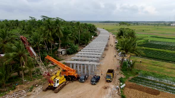 Work in progress for monorail road construction in Kulon Progo rural area, Yogyakarta in Indonesia. alt