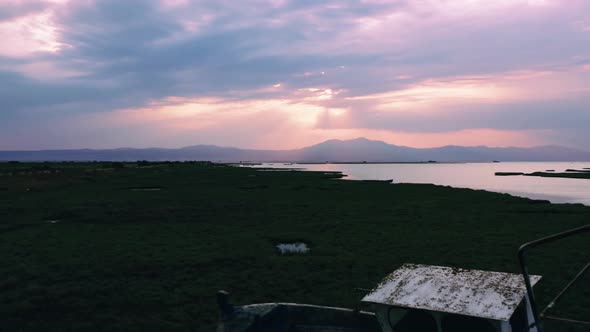 Scenic sunrise over the wetland of estuary of river. alt