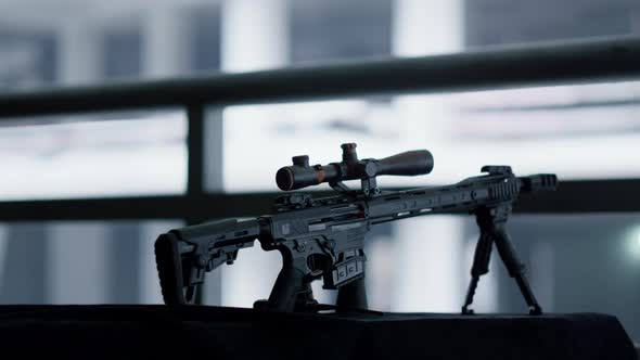 Sniper Rifle with Telescopic Sight Mounted on Bipod alt