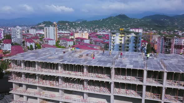 construction site of residential building with workers. monolithic construction. alt