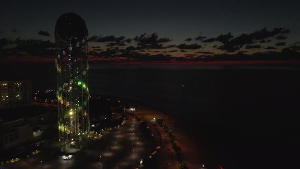 Batumi, Georgia - August 12 2020: Flying at night over the central boulevard in Batumi alt