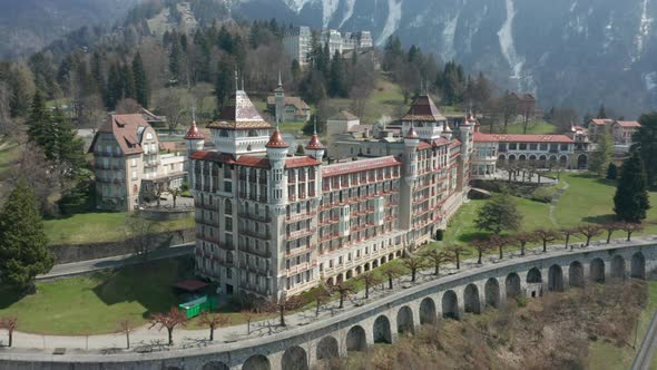 Flying towards beautiful Caux Palace Hotel. Building of the Swiss Hotel Management School, one of th alt