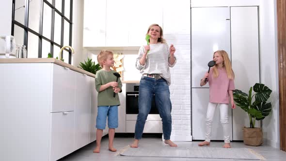 Excited Mom or Babysiter and Two Kids Boy and Girl Jumping Dancing Laughing in Modern Scandinavian alt
