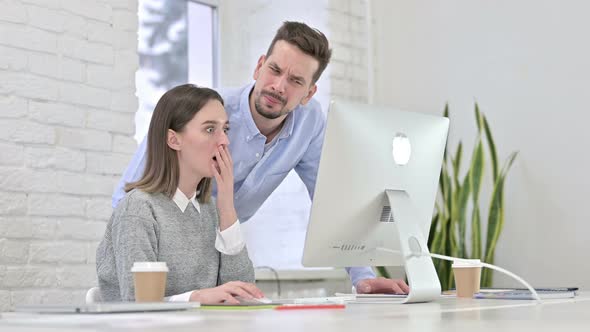 Disappointed Creative Team Reacting To Failure on Desktop alt