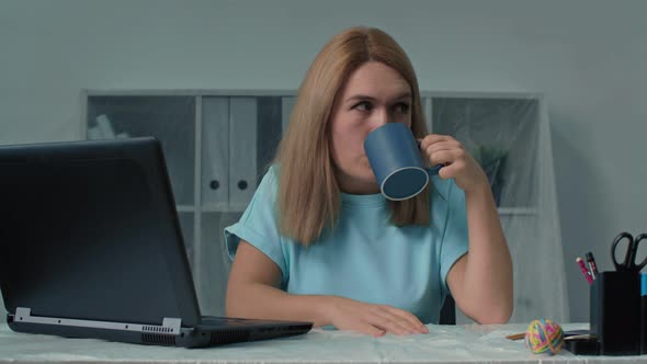 Businesswoman Having a Cup of Tea at Her Working Place Professional Businesswoman Finance Adviser alt