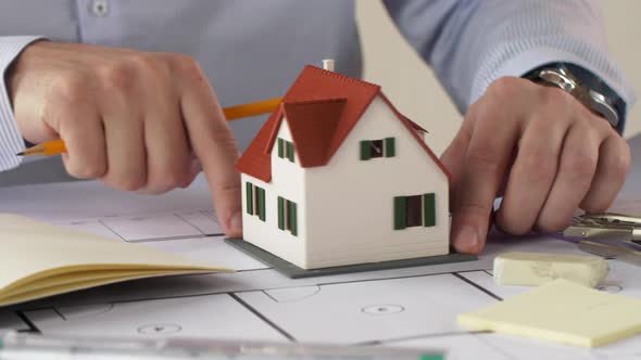 Male Architect with House Model and Blueprint 44 alt