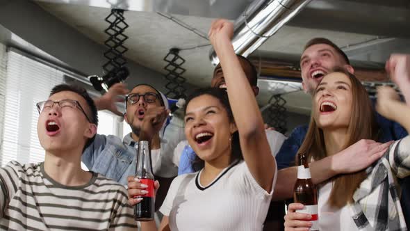 Multiracial people shouting for team