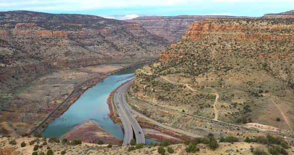 Colorado buttes with Colorado river and traffic. Drone shoting down. alt