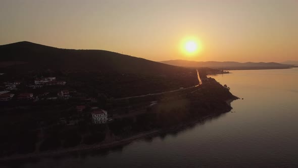 Aerial View of Trikorfo Beach Coastline at Sunset, Greece alt