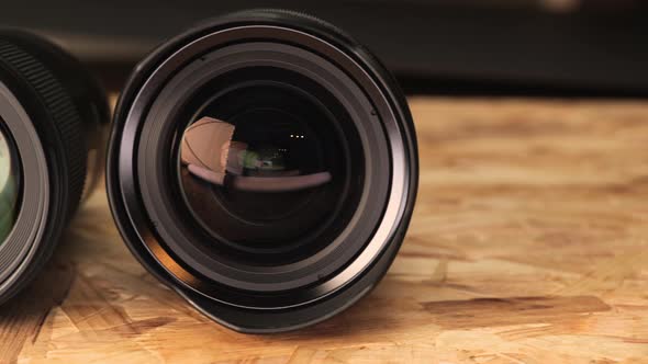 Different Kinds Of Camera Lens On Wooden Table. - close up, slider left alt