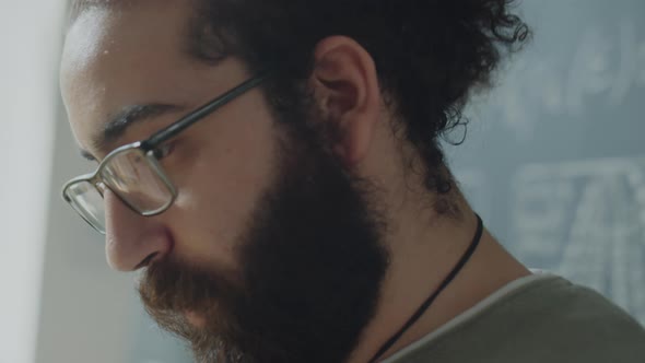 Bearded Student Talking during University Class alt