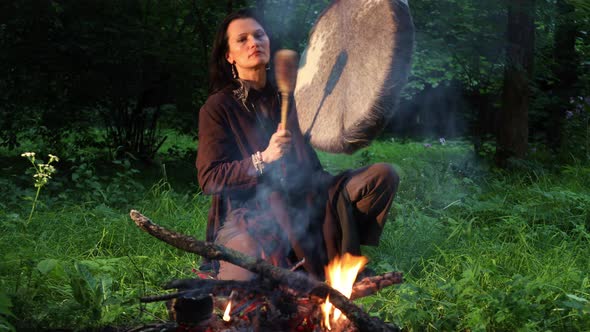 Shamanic Ritual in The Night Forest by The Fire