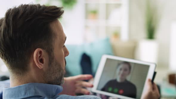 Video of man having video conference with a workmate. Shot with RED helium camera in 8K. alt