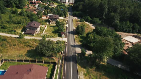 Aerial view; drone flying over streets of mountain village