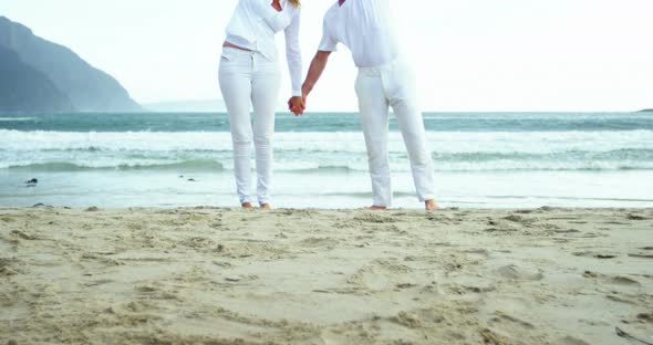 Mature couple together at beach alt