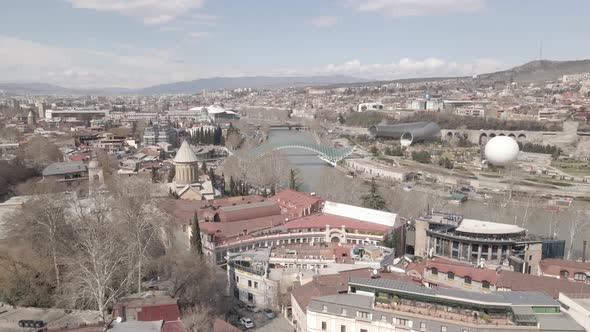 Aerial view of Tbilisi city central park and Bridge of Peace. Beautiful cityscape of old Tbilisi alt