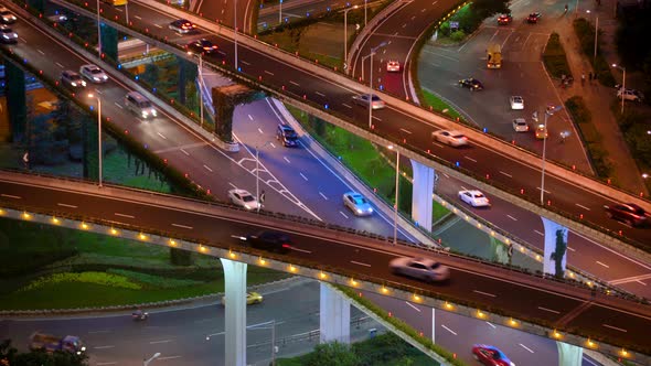 busy interchange traffic at night in city alt