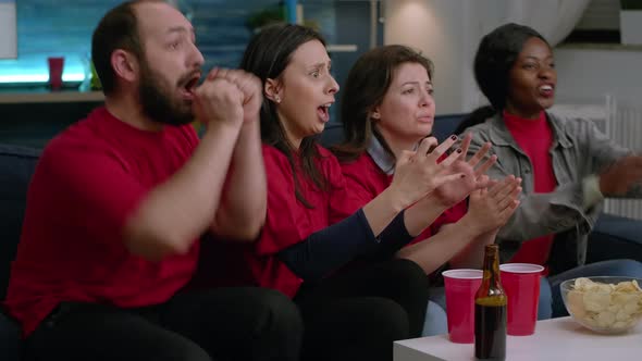 Exicited Multiethnic Friends Group Cheering Together After Foottball Team Winning Match Competition alt