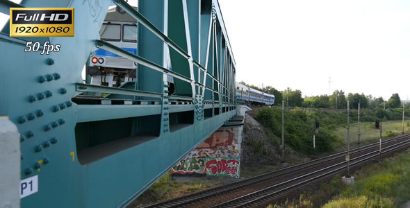 Passenger Train Passes Through the Bridge