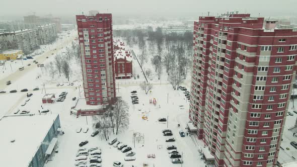 Highrise Buildings in a Residential Area of the City are Covered with Snow alt